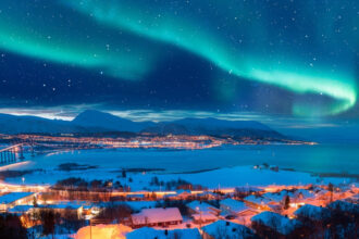 Aurora Borealis over Alaska, Northern Light Tours with expert guides, hot springs excursions.